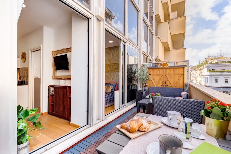 Terrazzo attrezzato dell’appartamento Lovely Home Fabrizia a Roma