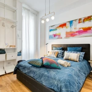 Zona notte con letto matrimoniale dell’appartamento Lovely Loft Fabrizia a Roma