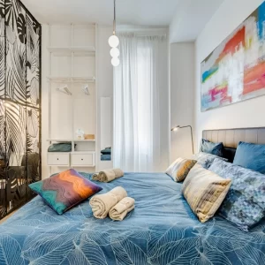 Zona notte con letto matrimoniale dell’appartamento Lovely Loft Fabrizia a Roma