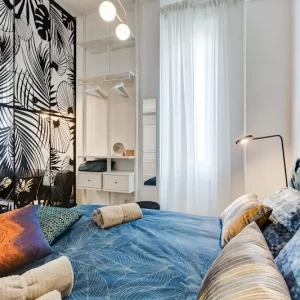 Zona notte con letto matrimoniale dell’appartamento Lovely Loft Fabrizia a Roma